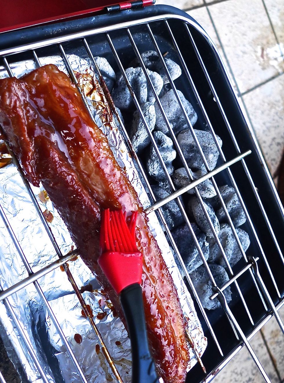 Brush the pork strip with the barbecue sauce.