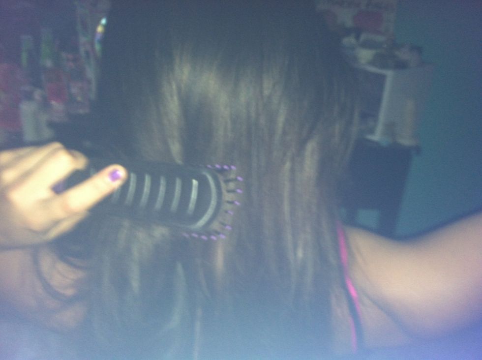 Brush the spray through your hair with a brush.