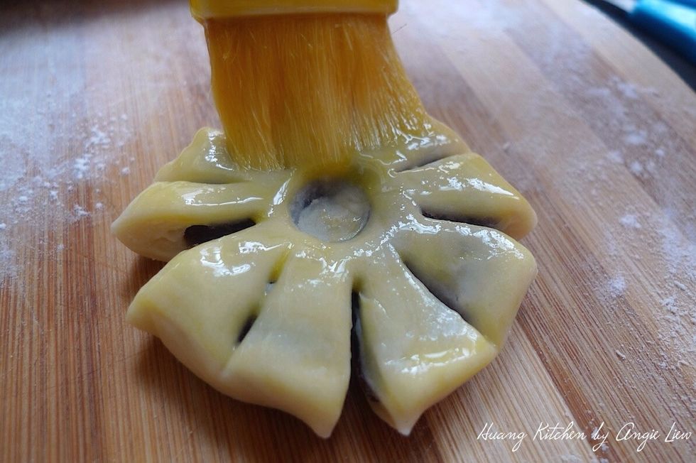 Brush the top with beaten egg yolk.