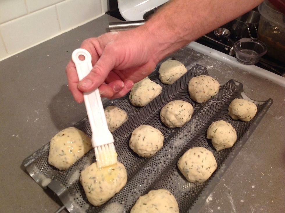 brush the tops of the rolls with melted butter and then cover loosely with plastic wrap.