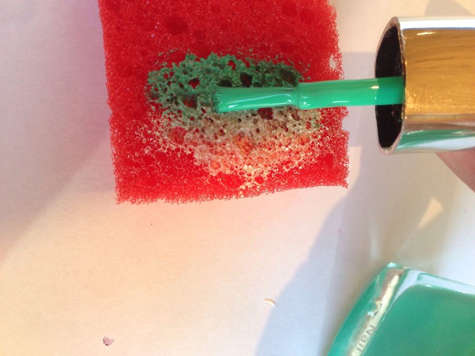 Brush the two colors ( base coat + a stronger color) on some sponge. Mix the two colors in the place where they meet.