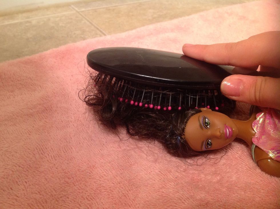 Brush there hair with a brush.