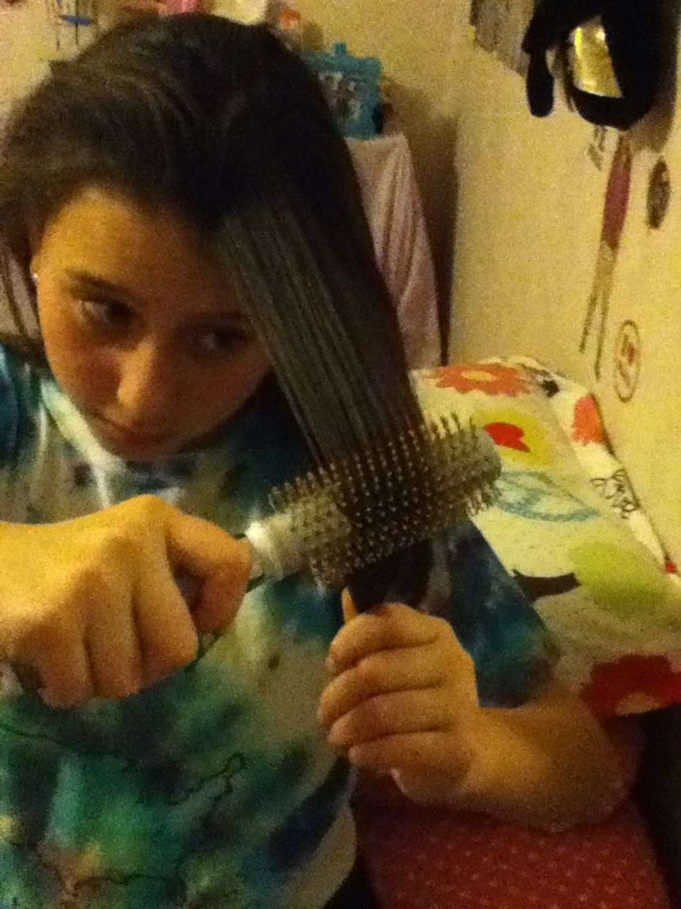 Brush through all of your hair so it is smooth