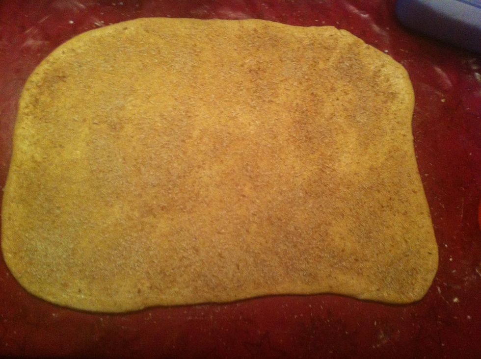 Brush with milk and combine coconut, sugar and cinnamon and sprinkle over the dough.