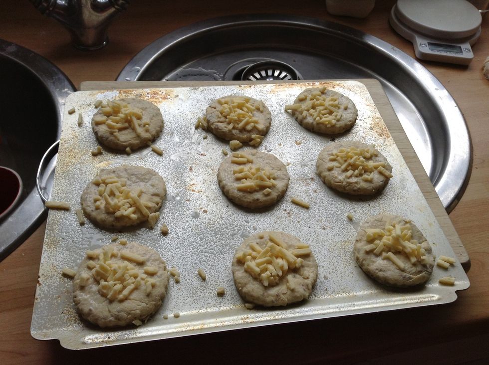 Brush with milk and sprinkle with the remaining cheese