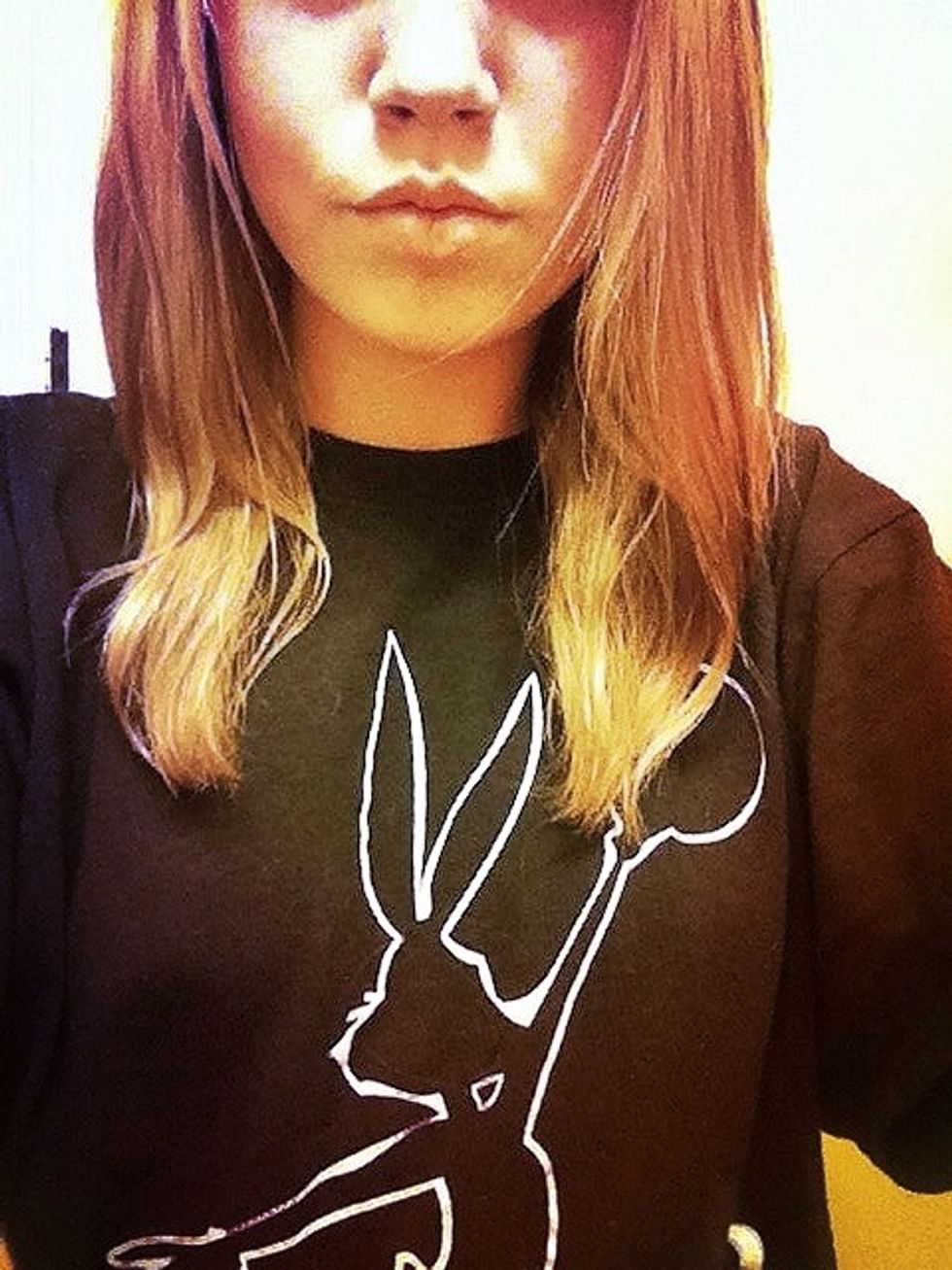 Brush your hair and part it down the center. If it helps, you can damp your hair down with some water however don't drench it or it won't dry.(: Split your hair in half.