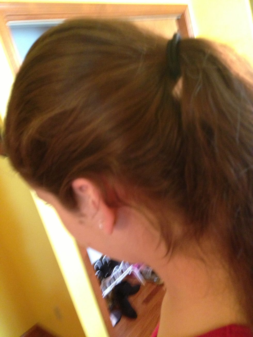 Brush your hair back into a high ponytail.