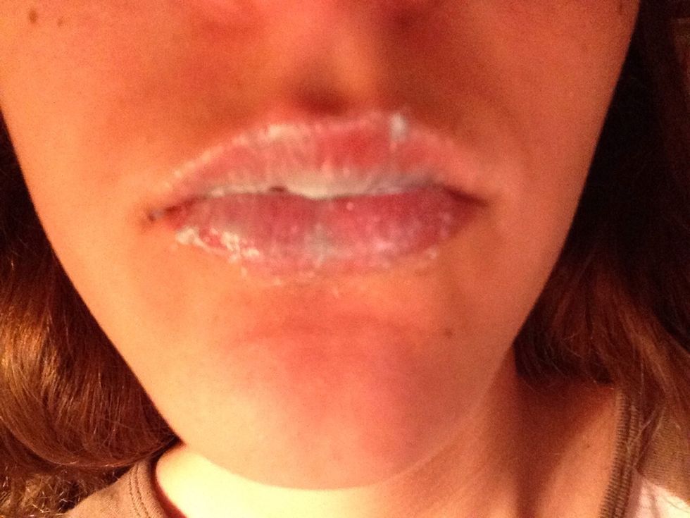 Brush your lips with your toothbrush and mintiest toothpaste until they are covered