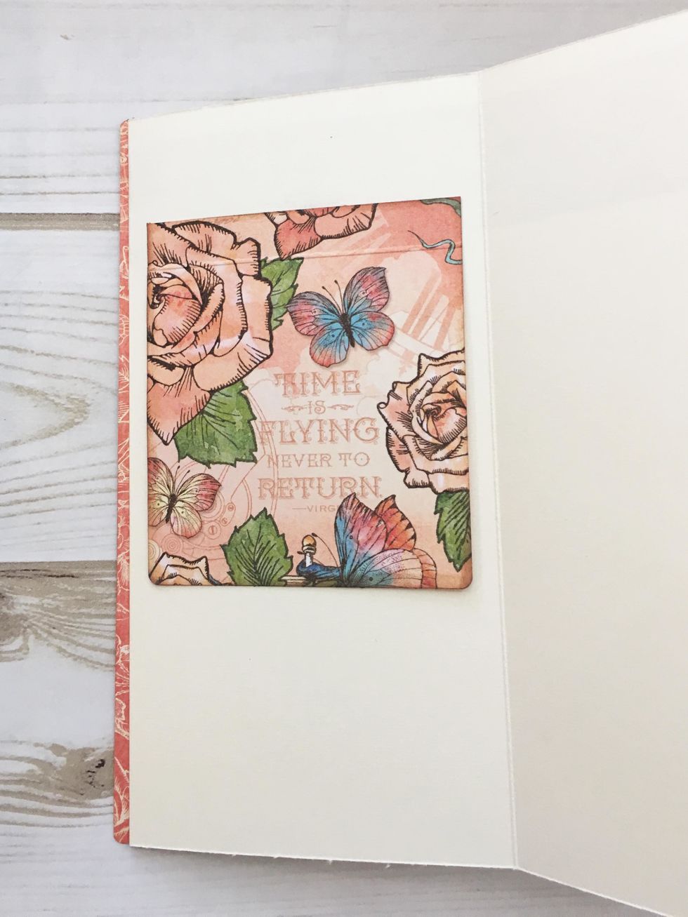 Build a photo waterfall on the ivory page next to the cover. (See photo in step 25) Adhere the first photo flap about 1 1/4" from the top of the page, centering from side to side.