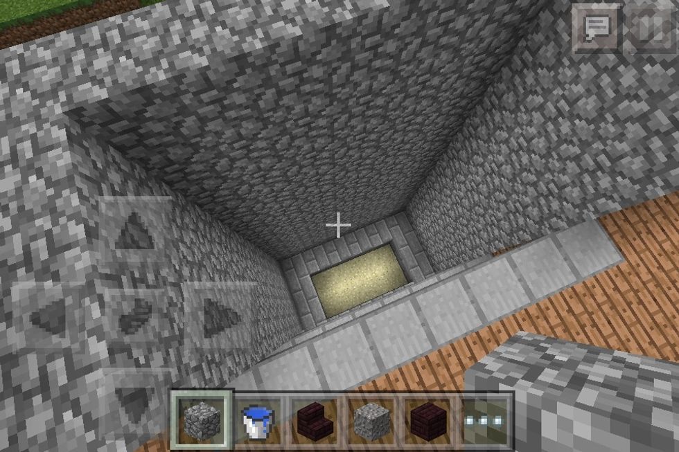Build the chimney up to the wood on the top floor.