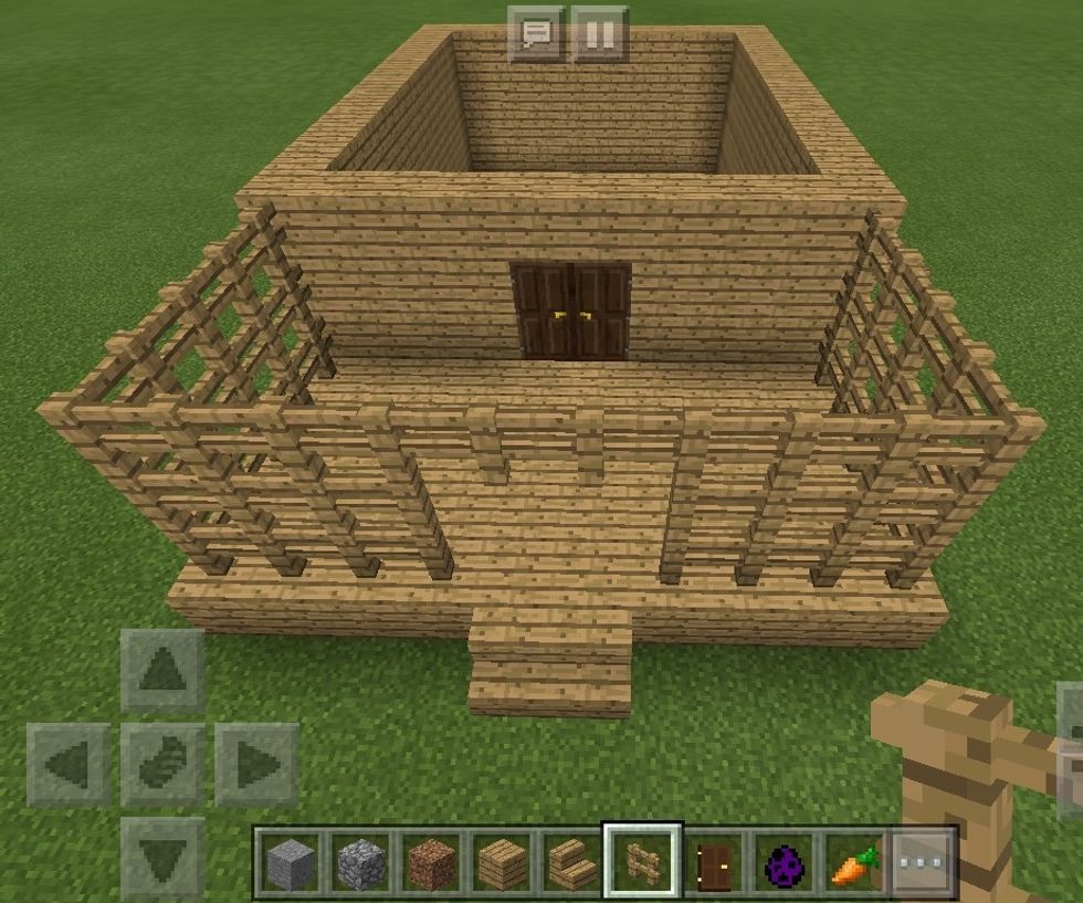Build the fence up two more blocks, this time crossing over the top on the last level.