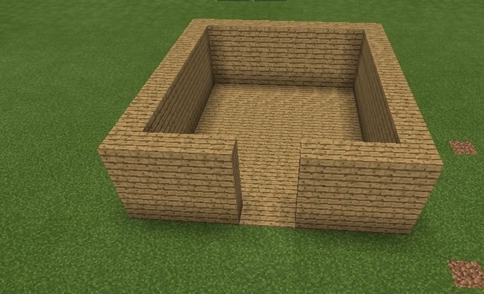 Build the house up another block, again leaving two spaces.