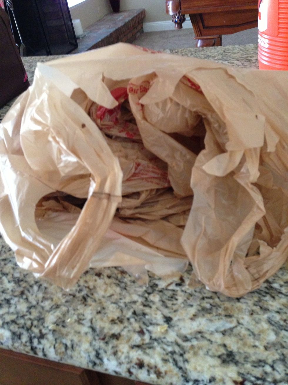 Bulky plastic bags from the grocery store are good for saving to use around the house, but they tend to take up room and get tangled together.