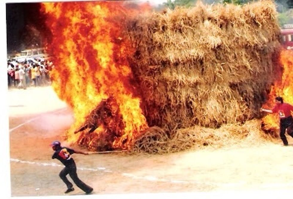 Burn it. The hay will burn in less than a minute and you will be left with a needle and some ash.