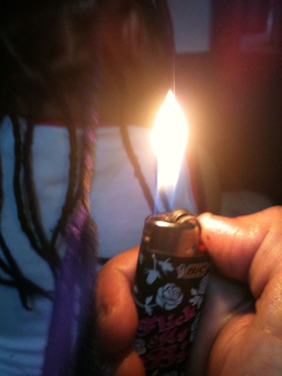 Burn the yarn at the end and roll between your fingers