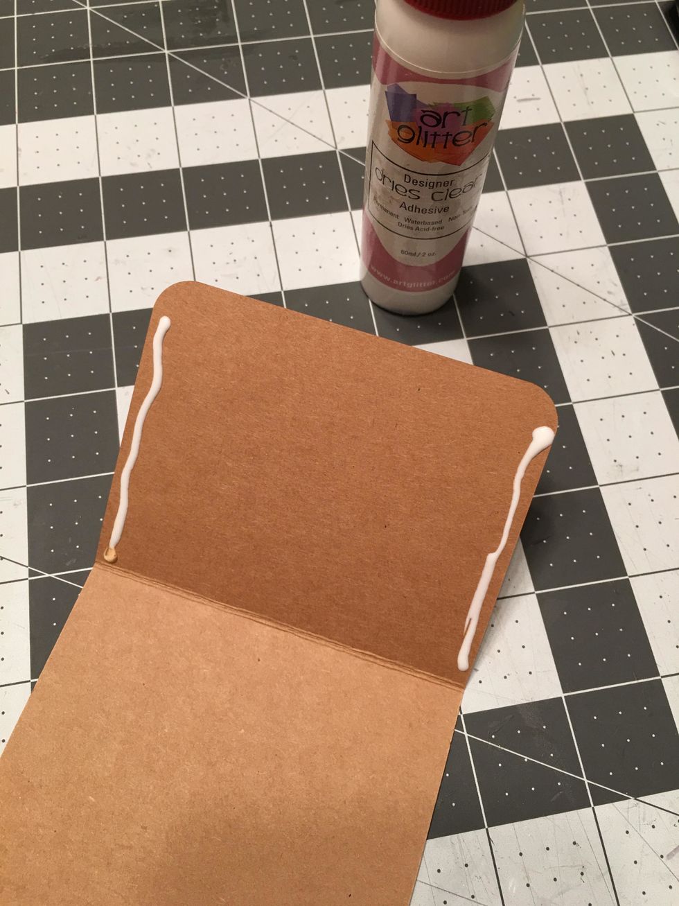 Burnish along the fold lines folding toward the front side of the tag, apply glue to the sides of the short fold side only and attach down onto the tag to create pockets. You will do this on 5 tags.