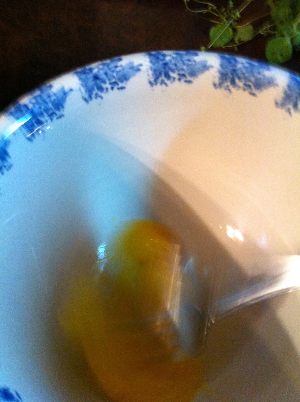 Bust the yolk and beat egg with fork.