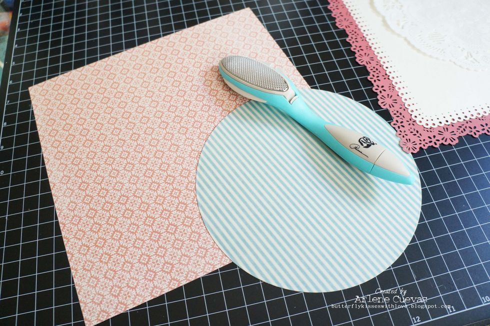 But before I start to adhere all the layers down, I will be distressing the edges of the papers using a paper distressing tool...