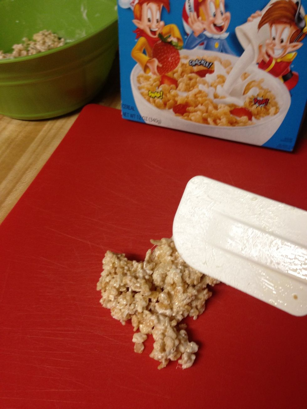 But I don't. So, take a cutting board and use the greased spatula to flatten out any sized amount of Rice Krispies treat that you just made.