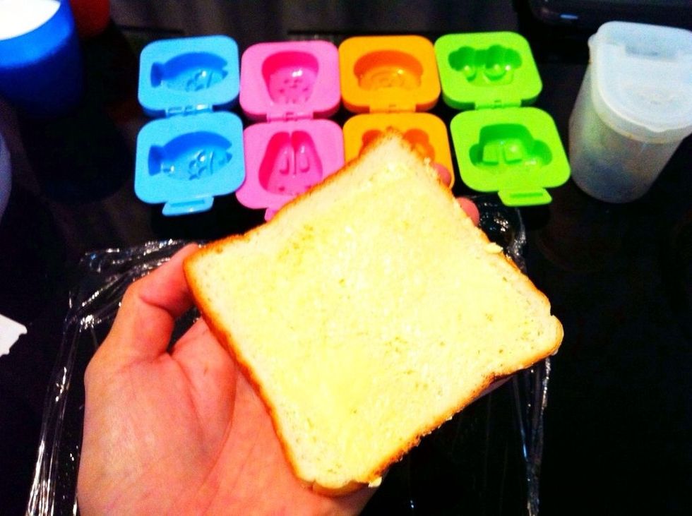 But we'll be using bread instead to make into character shaped buns. First, some spread. I use olive spread here but if you prefer butter, it's ok too.