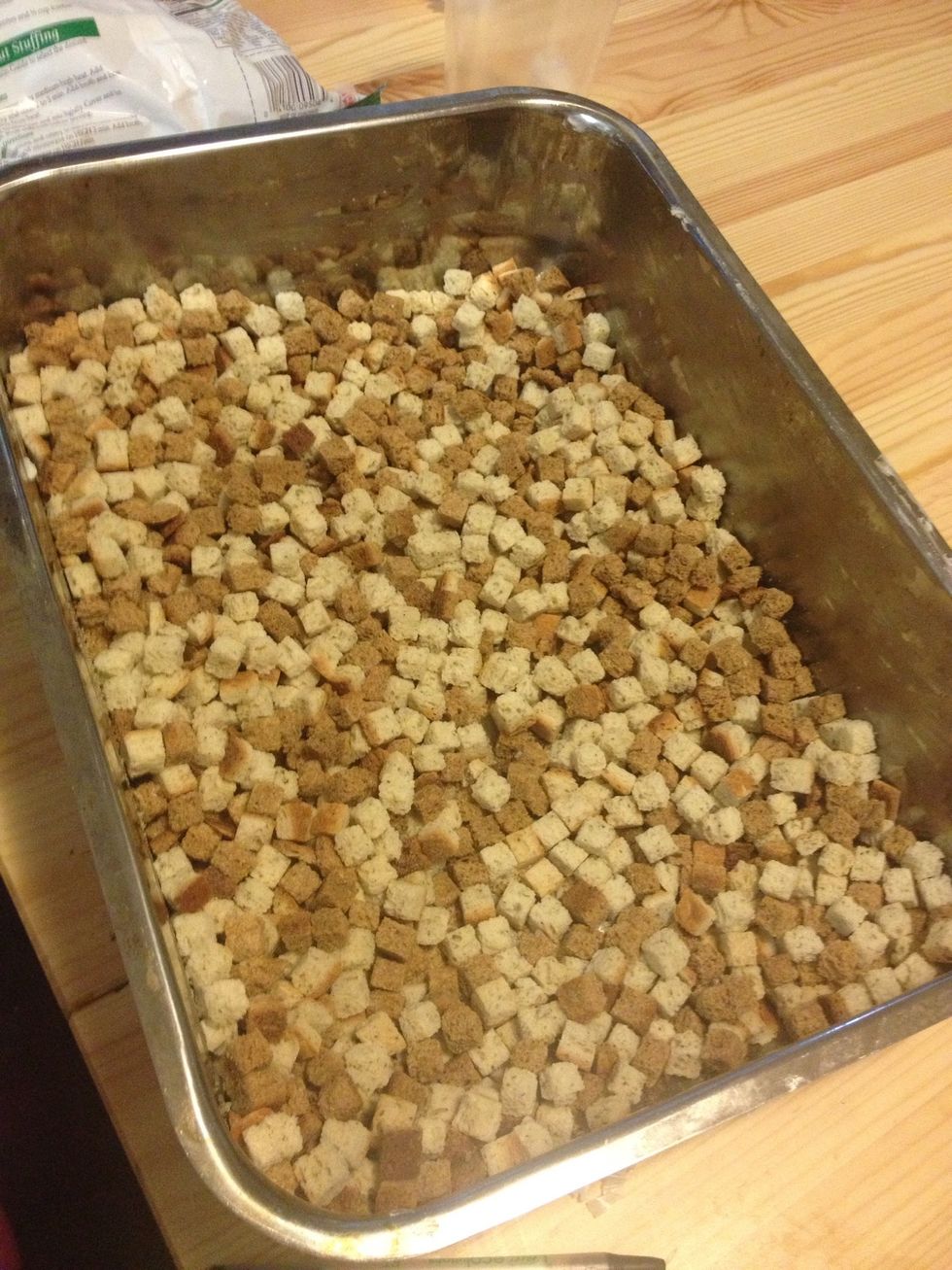 Butter a large baking pan. Add dry stuffing.