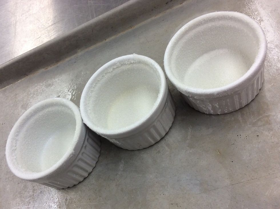 Butter and sugar the ramekins.