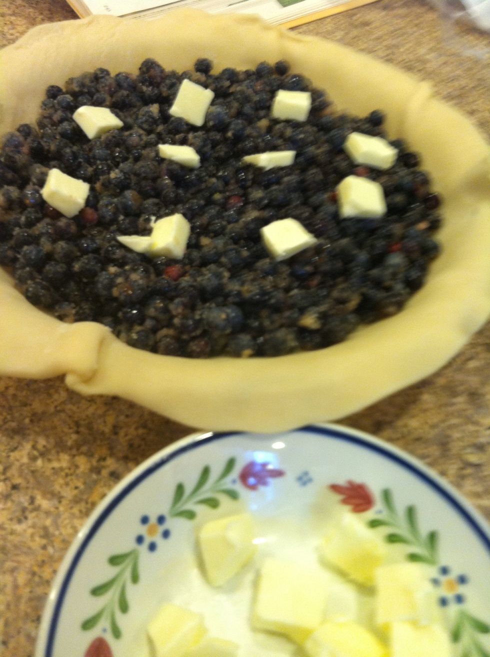 Butter...in a pie? Yes. Cut butter into small pieces. Pour 1/2 berry mixture into a prepared pie crust. Dot with butter. Repeat this process with the remainder berries and butter.