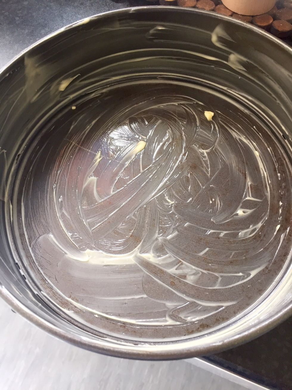 Butter the container for the mix that will go in the oven