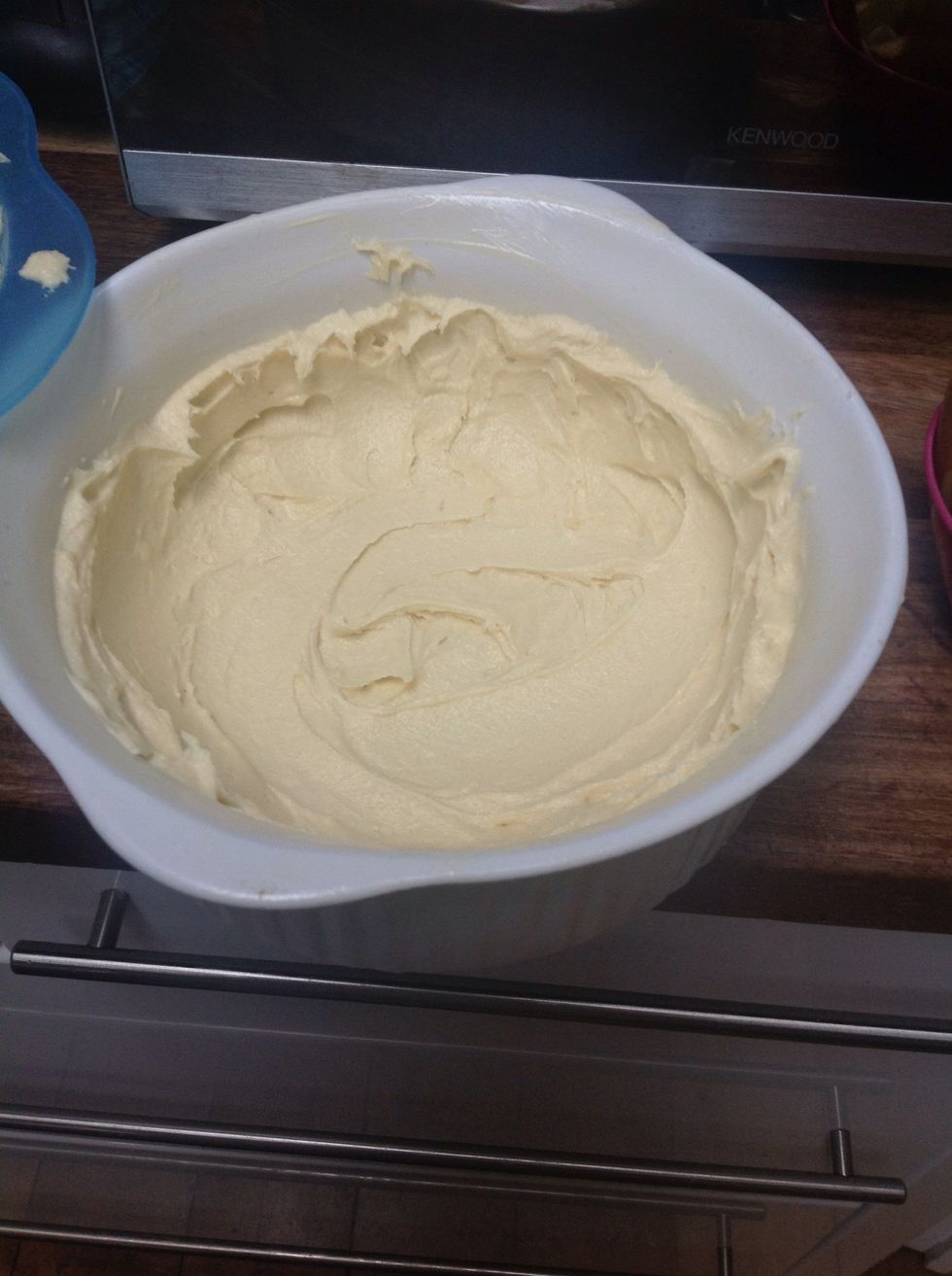 Butter the tray, place the dough to the centre and spread it towards the edges. Leave some dough to the side for later.