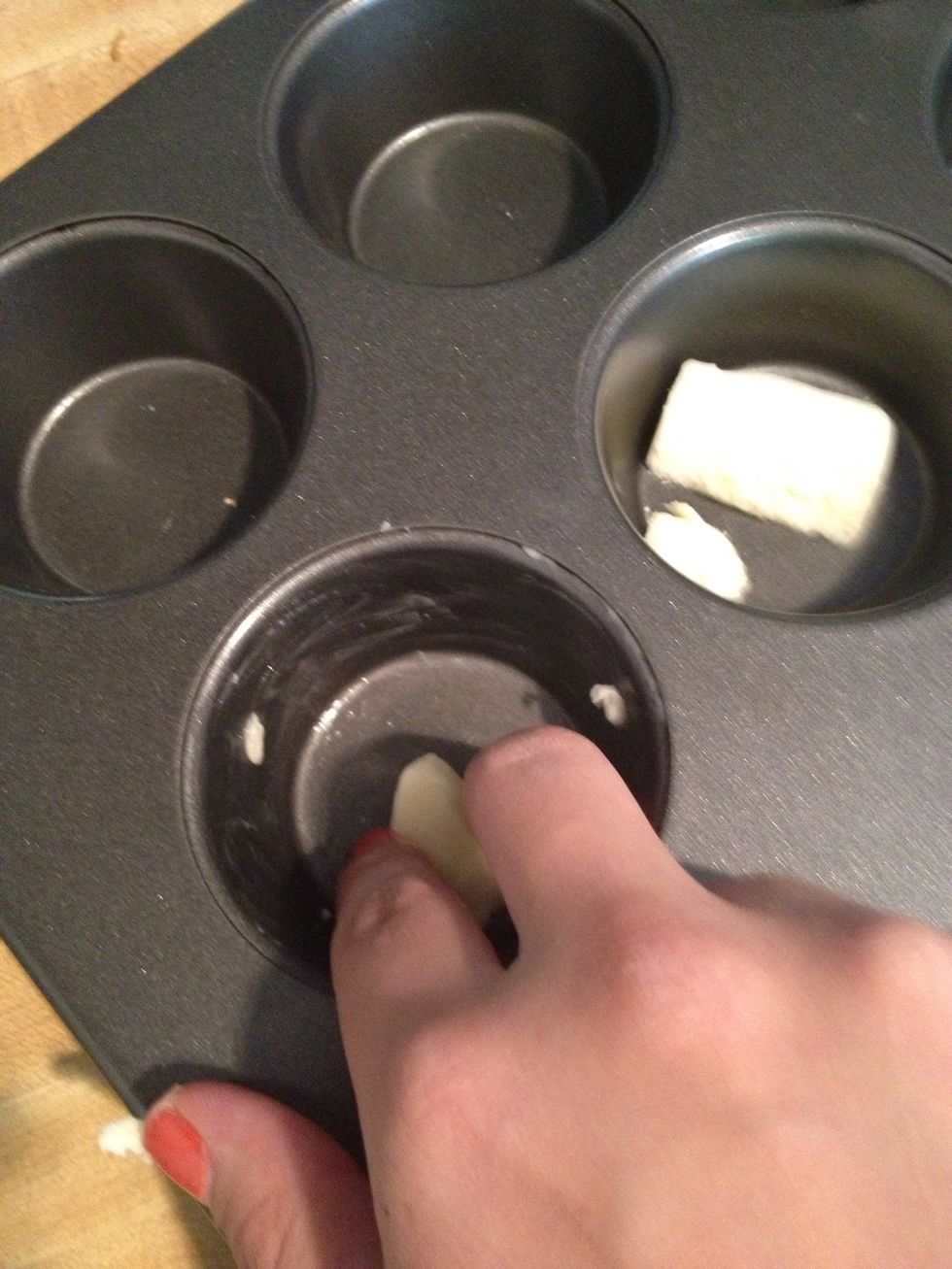 Butter your muffin tin or line it with cupcake liners