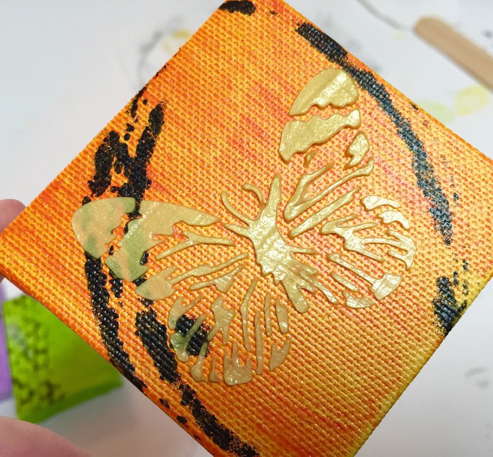 butterfly design added using Gold CM Metallic. set aside to dry or speed up dry time using heat gun. apply heat carefully, moving constantly and not overheating medium or it will bubble.
