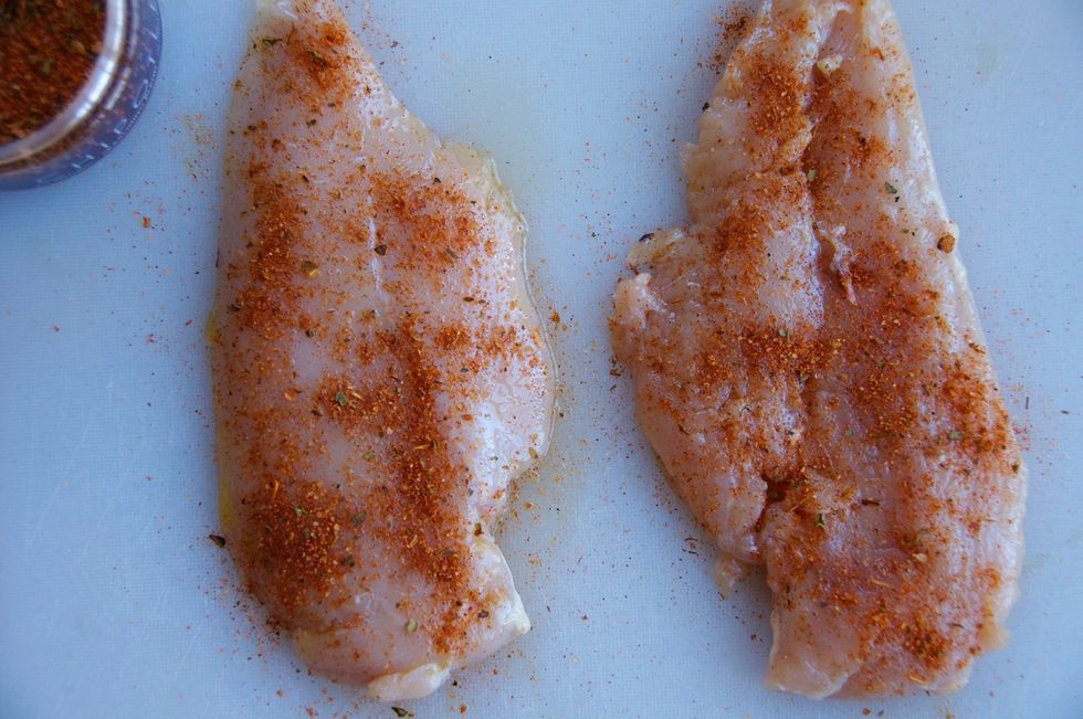 Butterfly the chicken breasts (cut in half, lengthwise) then brush with olive oil and use 1 tsp. of Smokin' Chipotle seasoning on each side of the chicken. Set aside and let marinate for 10 minutes.