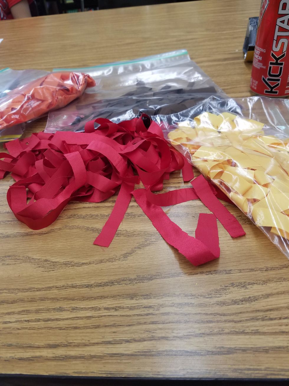 Buy and cut your desired colors of fabric into 6-8" strips that are 1/2" wide