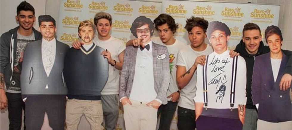 Buy posters, magazines, cardboard cutouts and anything else that has your band's face on it. If your parents say no to buying these items, try earning your own money and paying for the items yourself.