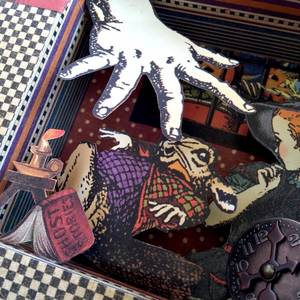 By last, glue a metal clock embellishment on the right.