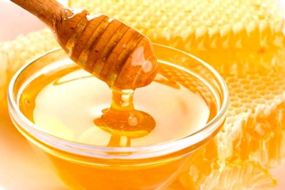 By means of a paintbrush, to whitewash(paint) your amuse mouths with some honey