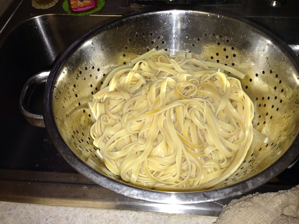 By now the noodles should be ready so go ahead and drain them.