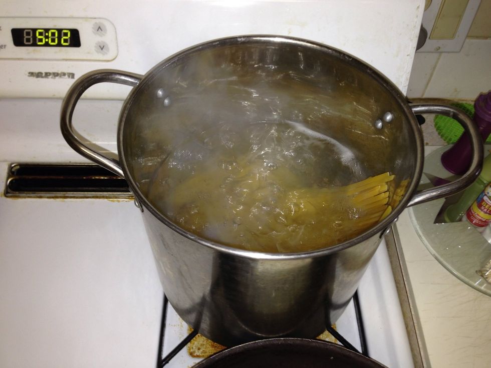 By now water should be boiling so go ahead and add the fettuccine (or other pasta).