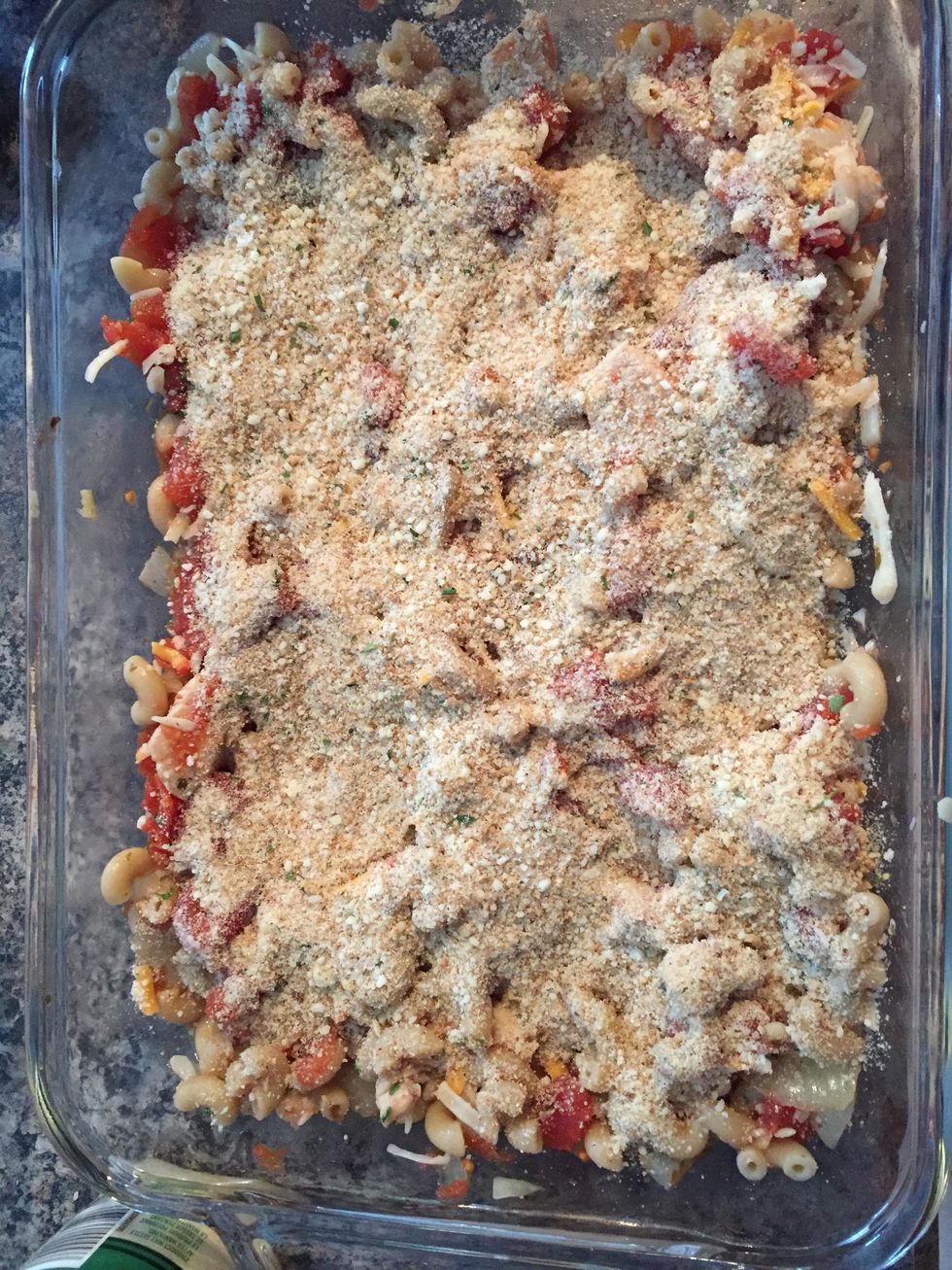 By now your corn should be done, add it to the casserole dish. Add the bread crumb mix on top.