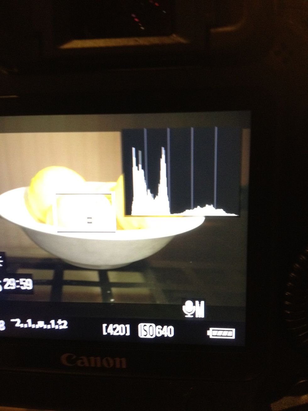 By pressing the INFO button, display the histogram. Adjust your exposure via ISO/aperture/shutter until the white areas don't touch the sides of the graph. This avoids blown out whites or blacks.