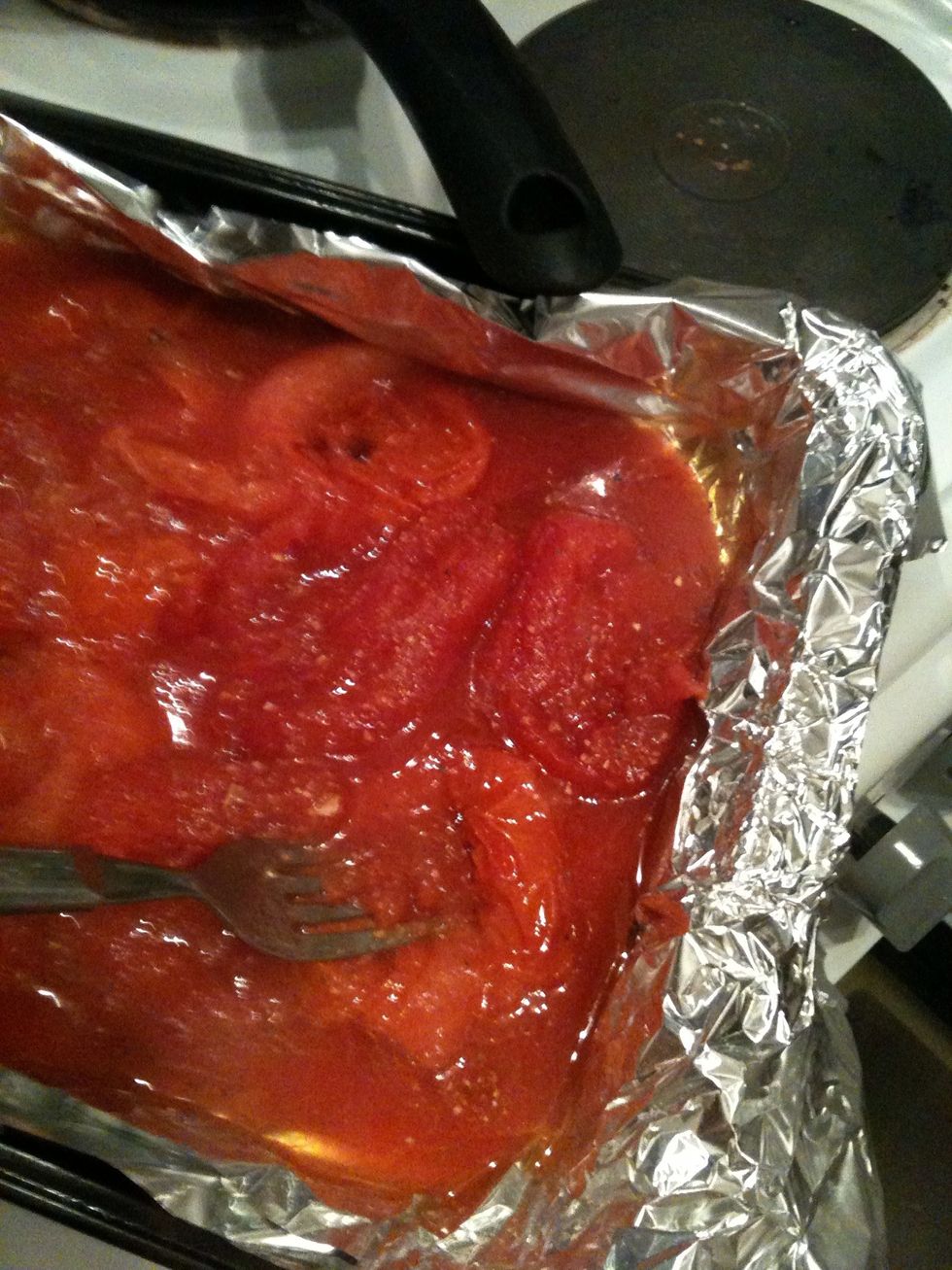 By the time your chicken is underway the tons should be all hot and smooshy :) give them a squash with a fork until they are like a thick sauce and put them back in the oven