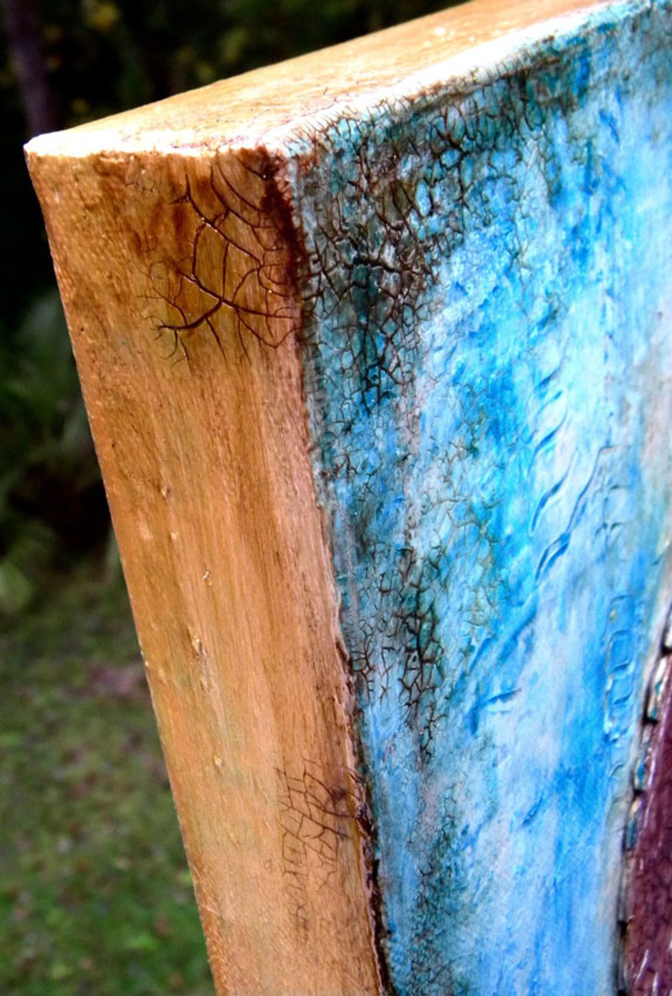 By treating the sides like a frame, I've made this a finished art piece, ready to hang on the wall. And by framing it with darker paint, it draws the eye into the painting and to the focal point.