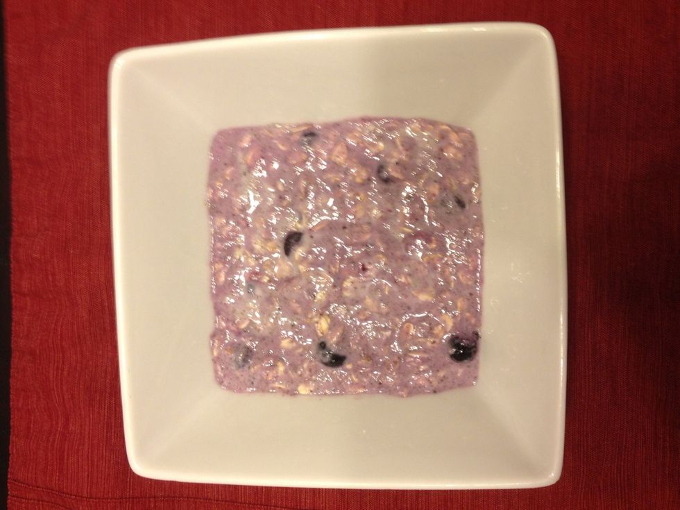 Calorie total: 1/2 cup oats 150, 1/2 cup almond milk 30, 1/2 cup yogurt 85, 2T chia seeds 60, 1/2 cup blueberries 35. Total 360!