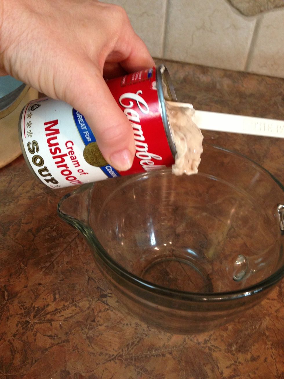 Campbell's Cream of Mushroom soup is an ingredient found in many of our Minnesota dishes. For this recipe it's the base for the gravy. Pour into bowl to mix with water.