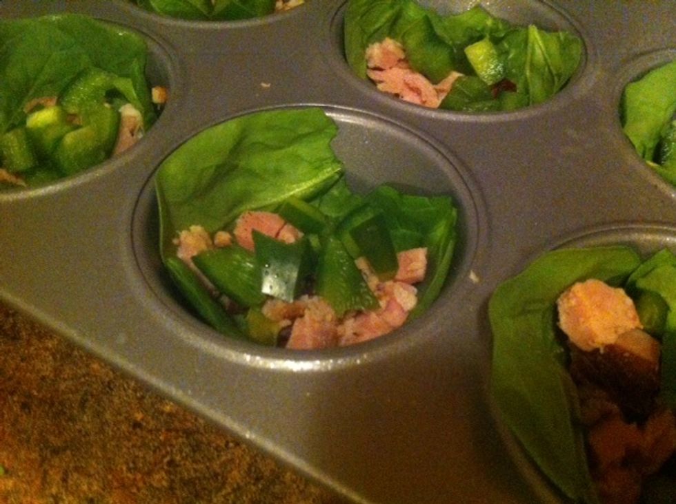 Can add your ham or whatever you'd like to your spinach crust. Disperse evenly amongst the 12 cups. I thought for future crustless quiche adventures I'd try adding bacon. mmmmm.. bacon.