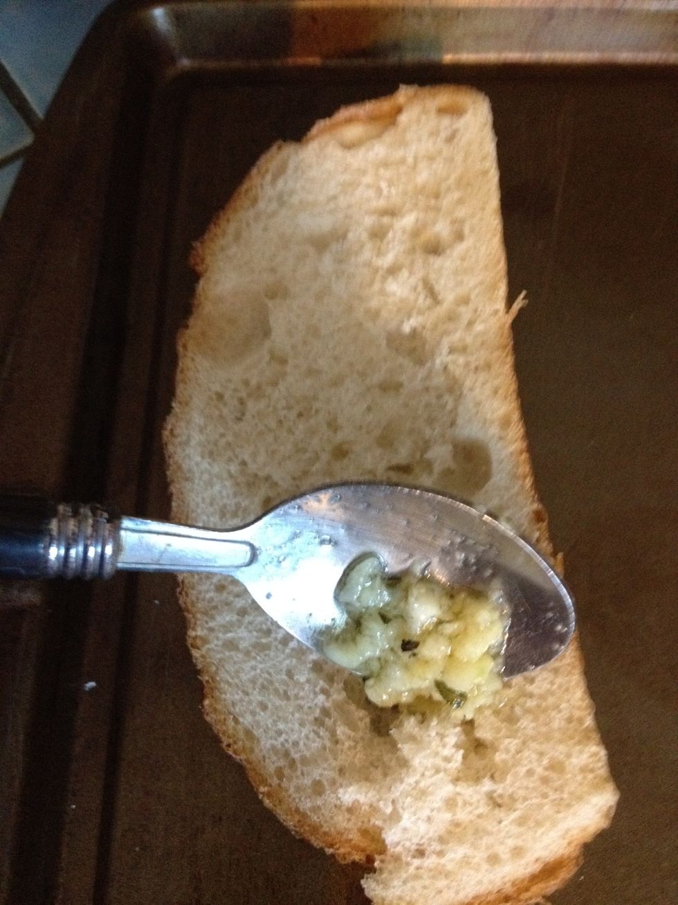 Can you smell the aroma of the garlic? Mmmmm!!! Now it's time to remove the mixture from the heat and spread onto your slices of bread. A teaspoon works just fine.