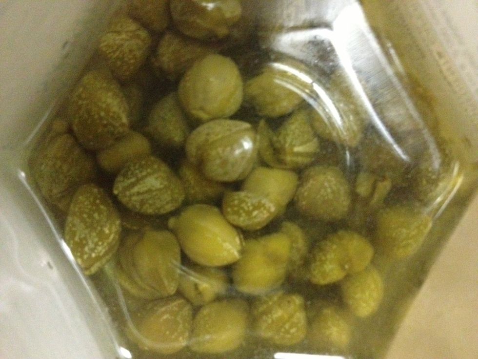 Capers are the flower buds of the caper bush native to the Mediterranean. Typically pickled in vinegar, this fridge staple is a must right up there with relish and dill pickles. Drain 1 tbsp of capers