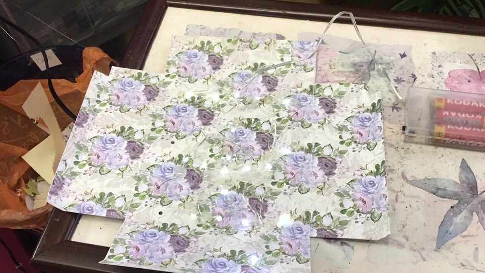 Card back, lights have been fixed in place with a glue gun, as the glue sets quickly.