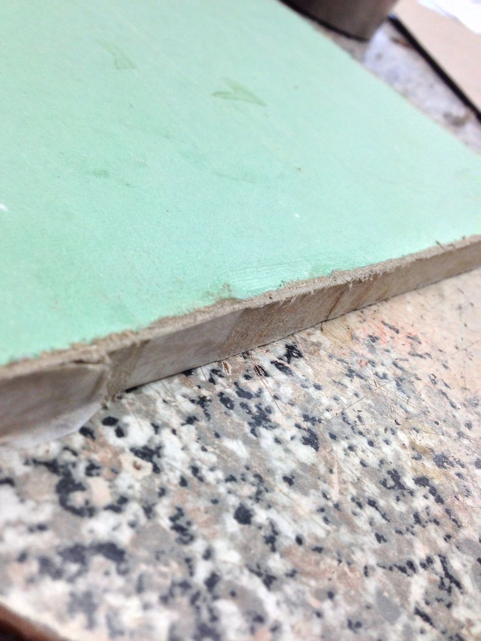 Cardboard strips glued to all four edges.