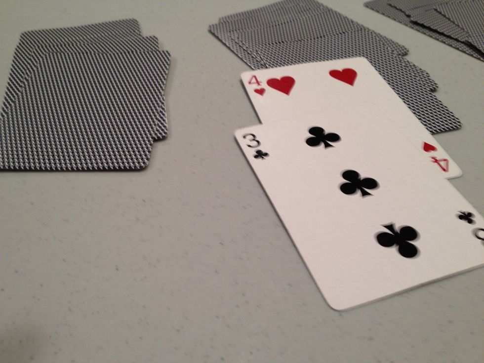 Cards that are one less and the different color can go under the card (here it is a 4 and a 3)